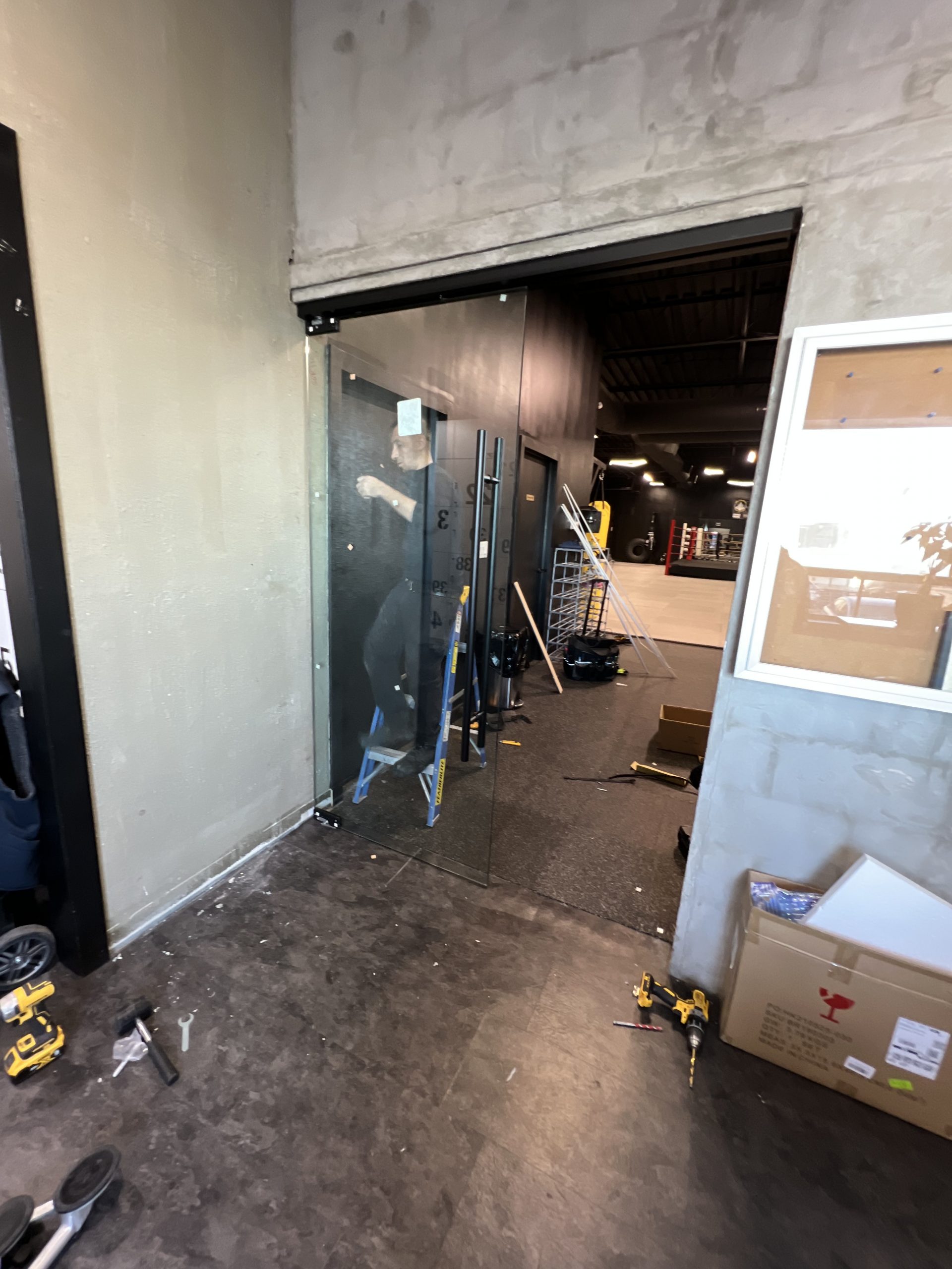 Glass partition installation in a commercial workspace